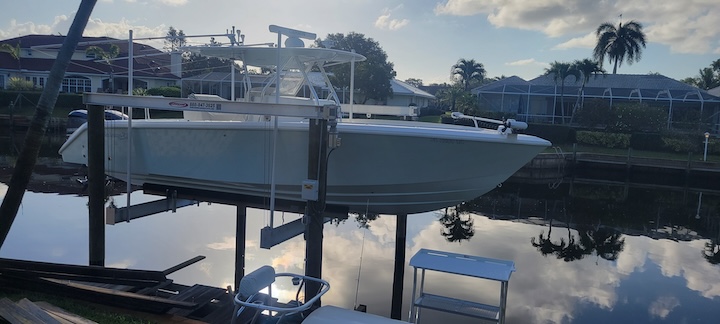 Hurricane Boat Lift Installation with Wooden Piles in Stuart, Florida Thumbnail