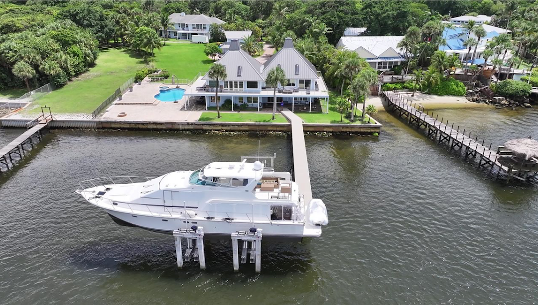 Premium Aluminum Dock with Concrete Piles, Vinyl Decking, and 120,000 lb Hi-Tide Boat Lift Installation in Stuart, FL