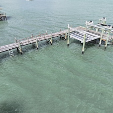 Premium-Aluminum-Dock-with-Concrete-Piles-Vinyl-Decking-and-120000-lb-Hi-Tide-Boat-Lift-Installation-in-Stuart-FL 5