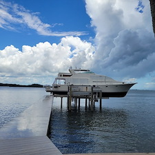 Premium-Aluminum-Dock-with-Concrete-Piles-Vinyl-Decking-and-120000-lb-Hi-Tide-Boat-Lift-Installation-in-Stuart-FL 0